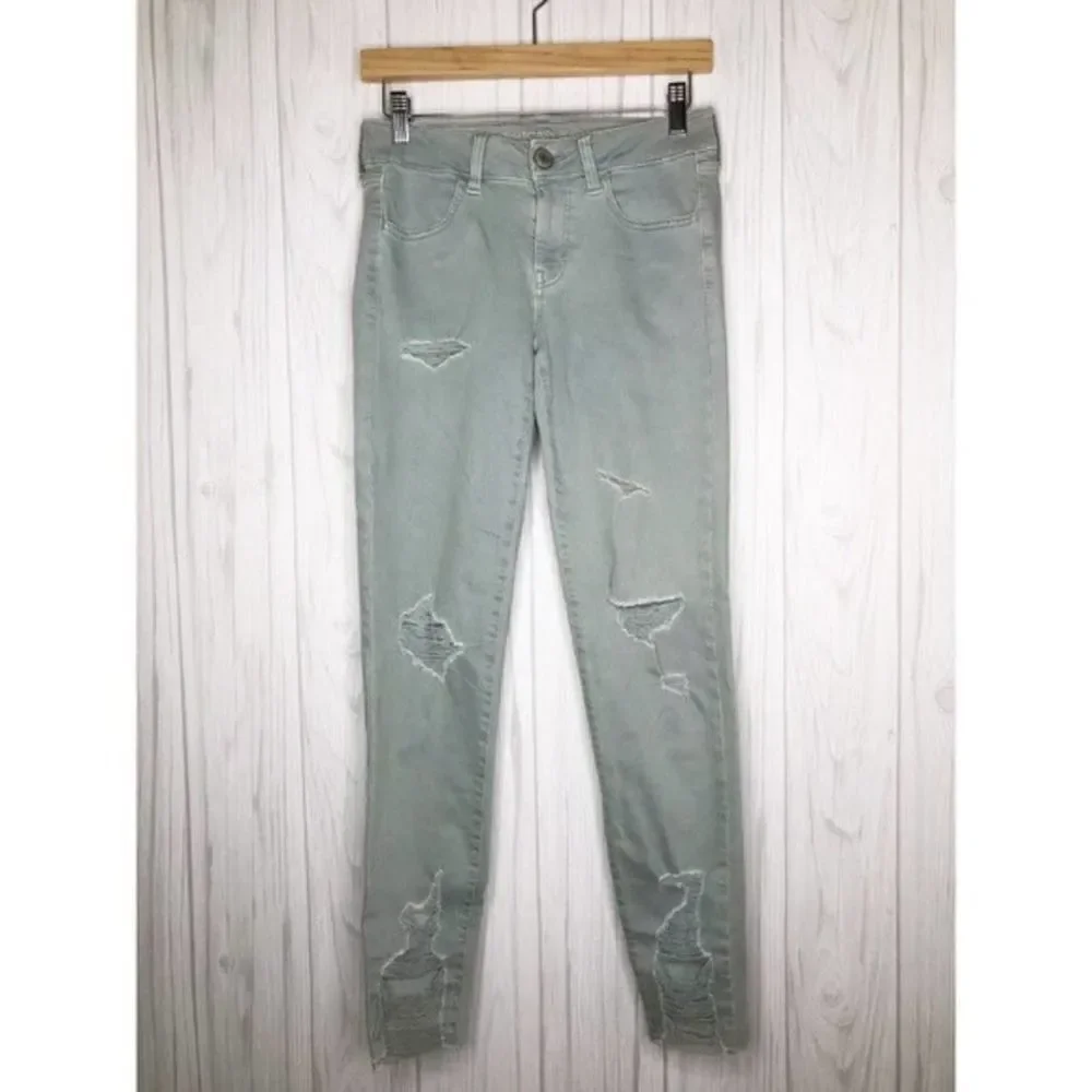 AMERICAN EAGLE Seafoam Destroyed Skinny Jeans